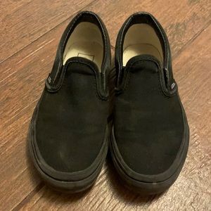 Boys (or girls) black slip on Vans.